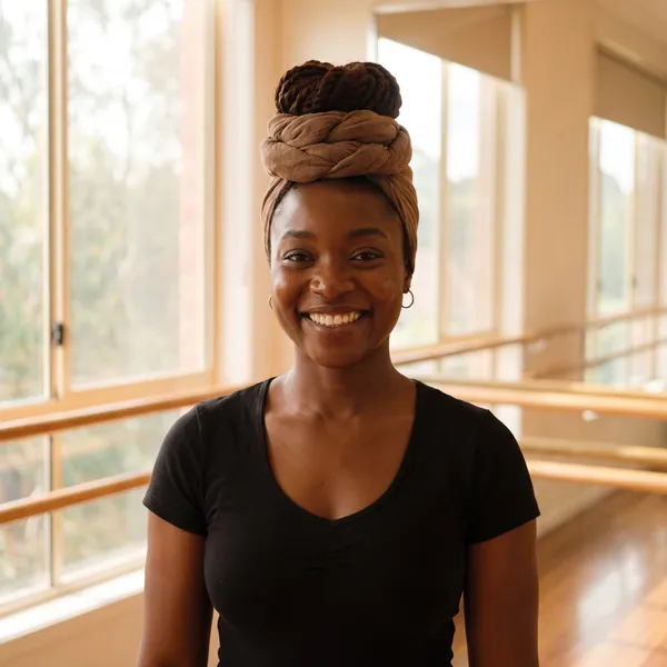 Zara Mensah, smiling, in the studio