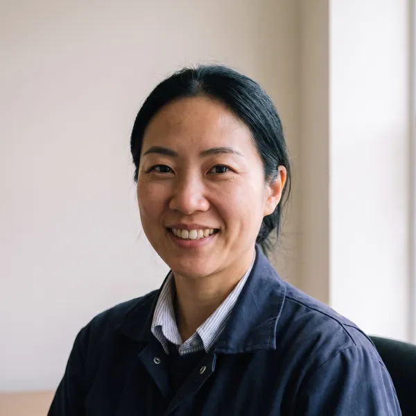 Hana Seo, smiling, in the office.