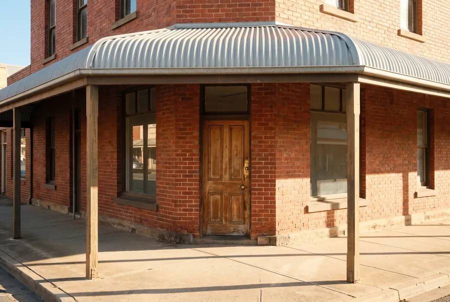 The Murray Wren office: a red brick building on a corner, with a verandah over the footpath